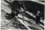 Detalle de construcción, obreros trabajando